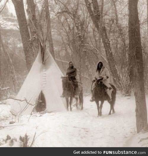 An incredible photo showing two Apsaroke Indians during Winter Camp in 1908. Edward