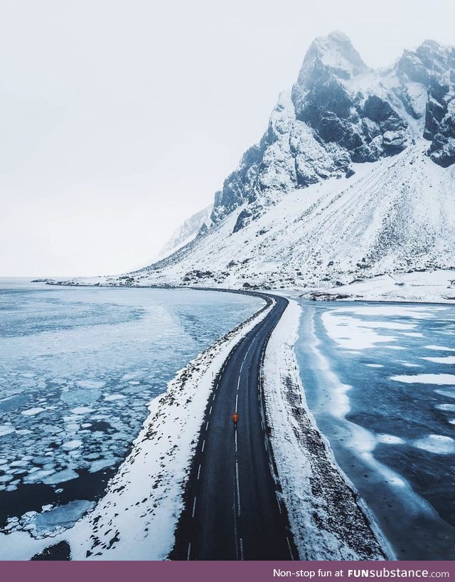 The frozen waters surrounding the road