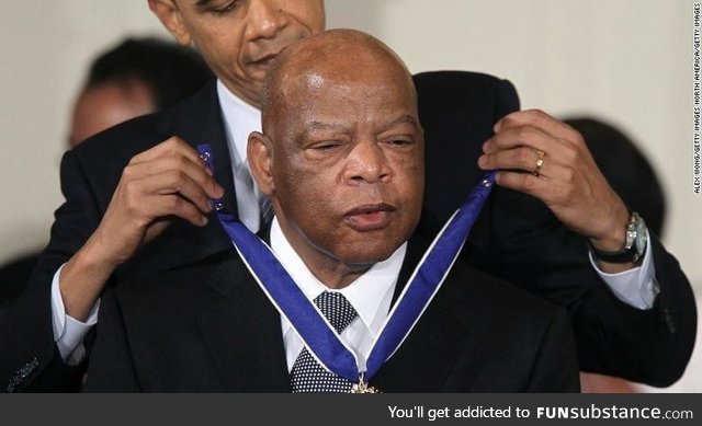 Barack Obama awarding the presidential medal of freedom to the late representative John