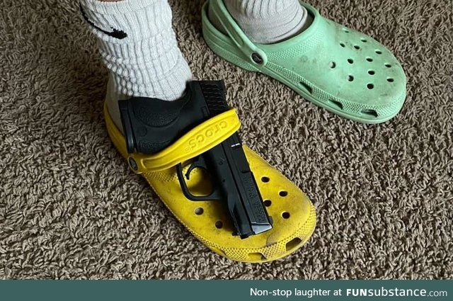 You've heard of elf on the shelf, now get ready for Glock on a croc