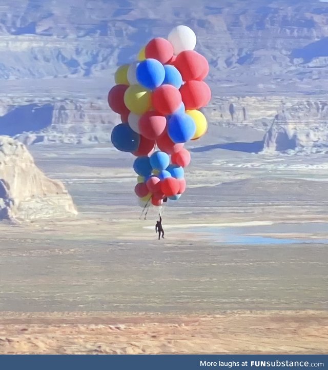 David Blaine nonchalantly floating over Arizona holding 52 helium balloons