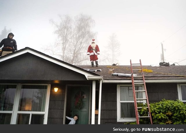 One of the roofers decided to dress up as Santa while installing our roof, today. My son