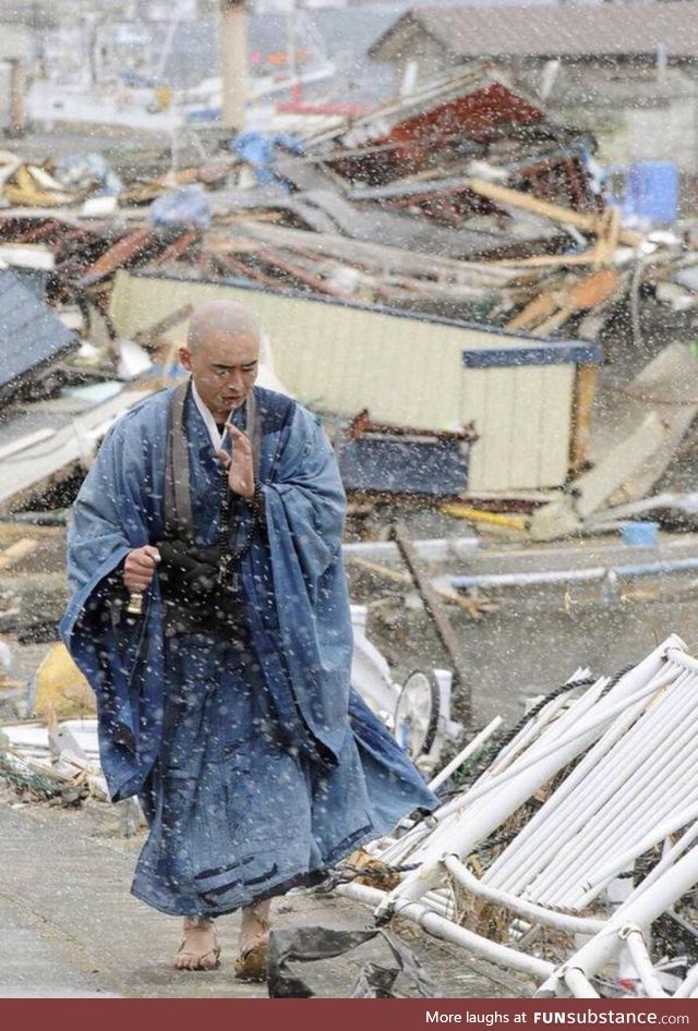 Japanese monk praying for the victims during the 2011 Tohoku earthquake and tsunami