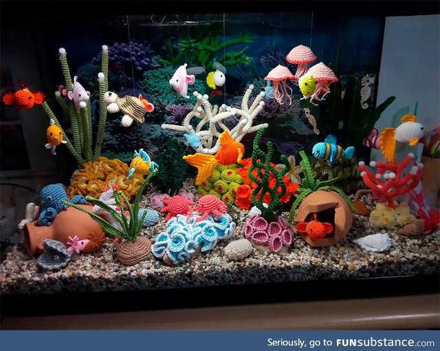 Incredibly detailed aquarium featuring underwater creatures all made out of crocheted yarn
