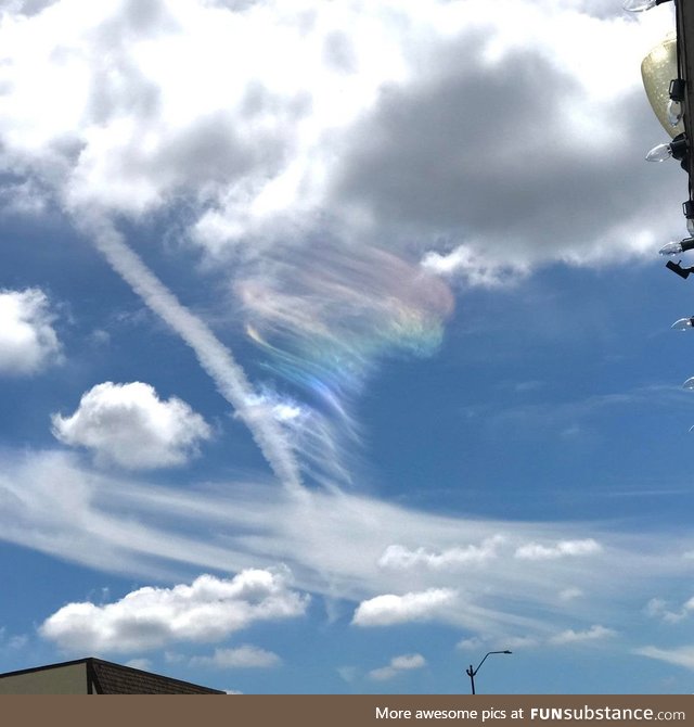 A tornado-shaped iridescent cloud