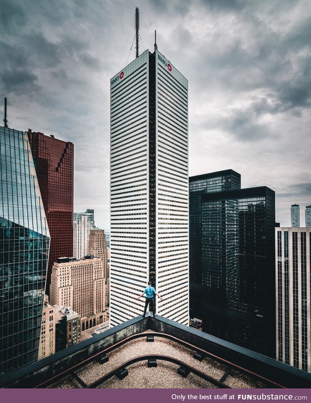 Standing on the edge of a skyscraper in Toronto