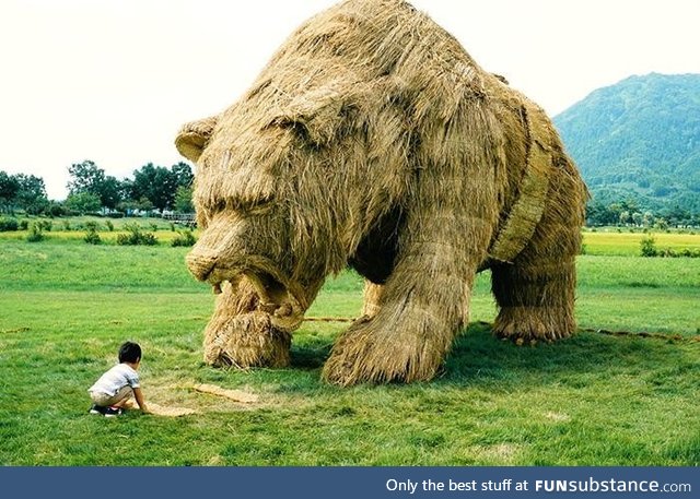 Bear sculpture made from leftover rice straw in Japan