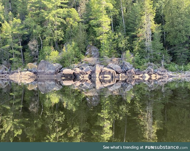 Canadian Shield rock reflection in La Mauricie National Park, Canada