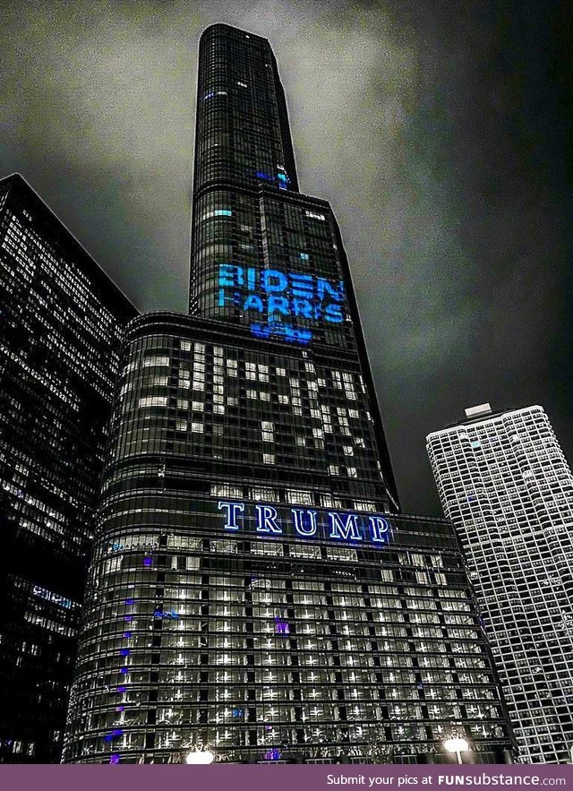 The Biden Harris logo projected on the side of Trump Tower in Chicago