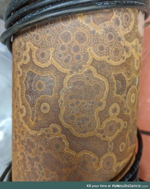 Rust patterns on an old wire spool