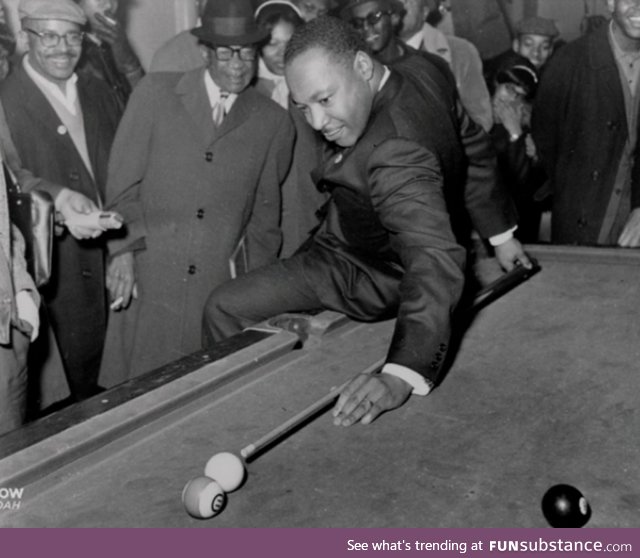 Martin Luther King Jr playing pool after a march
