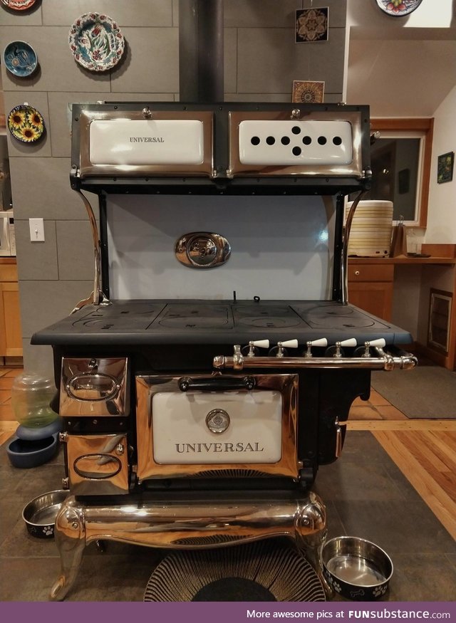 My parent's 1900's wood and gas burning transition stove, newly restored after 25+ years