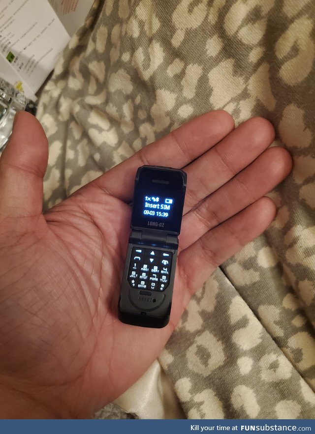 Bought the world's smallest flip phone today!