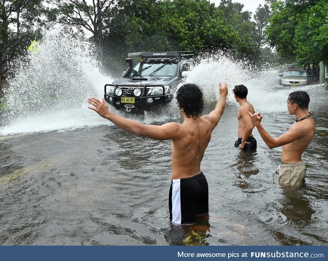 Australians celebrate in the still-rising floods
