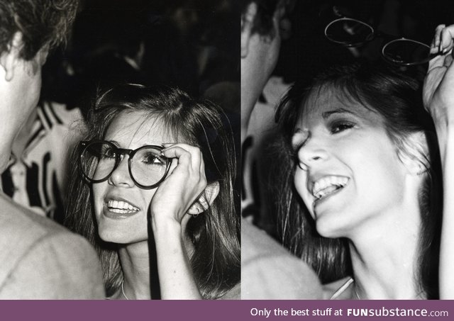 Carrie Fisher trying on Peter Weller's Glasses