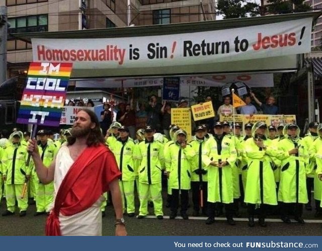 Christian protesters hung a banner at a Seoul pride parade. Robert Evans