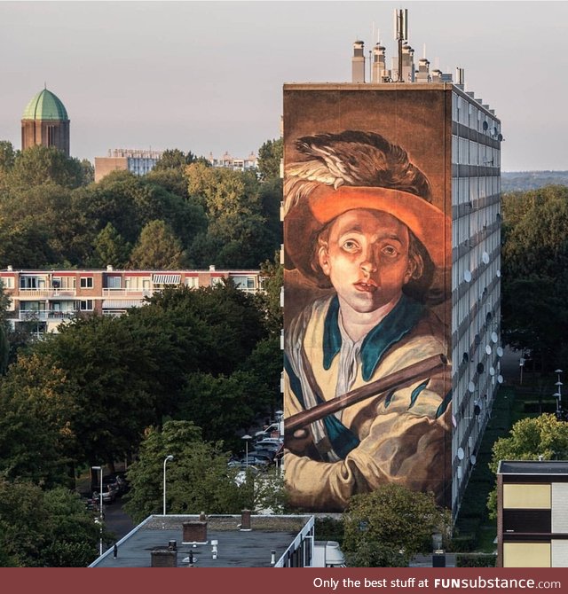 A huge mural on the side of a flat