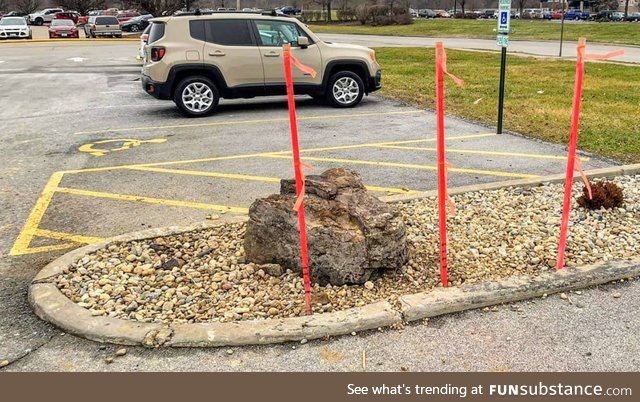 Update: Local donut shop put up stakes to keep people from driving over the rock that was