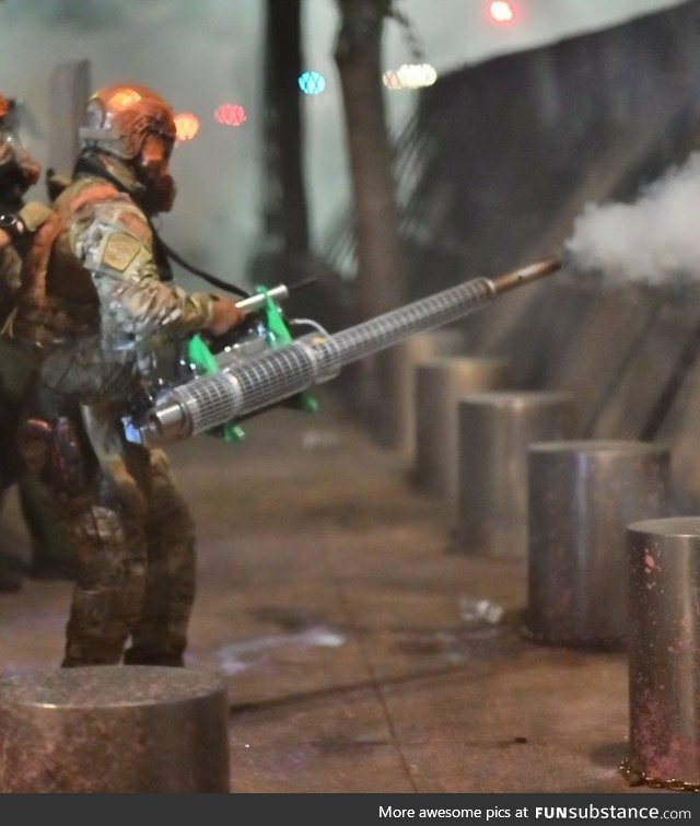Federal Solider using pesticide sprayer to spray US, Portland protestors with unknown