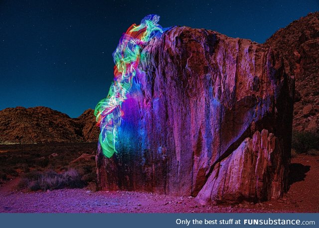 Long exposure photo that I took of myself rock climbing with LEDs tied to my body