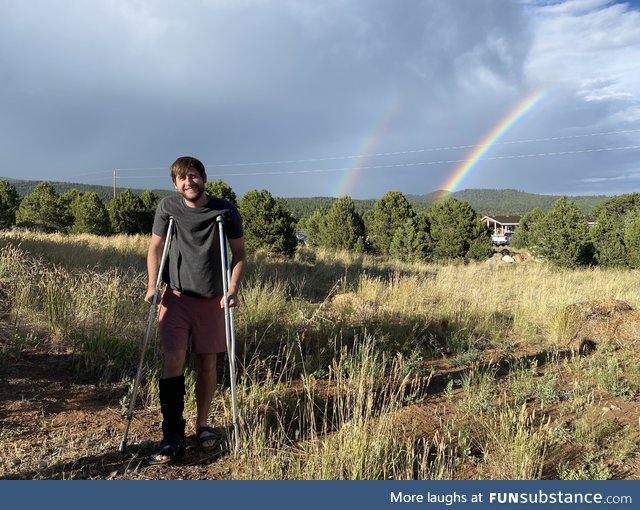 Here is a photo of me with my newly broken foot in front of a double rainbow