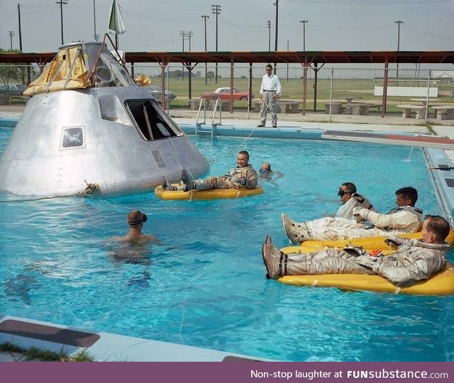 NASA actors rest after filming the final splash down scene for the moon landings