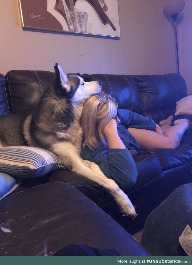 My dog using my wife as a pillow