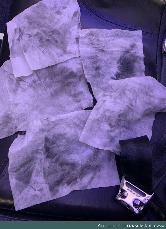 What the wipes look like after cleaning my airplane seat and headrest