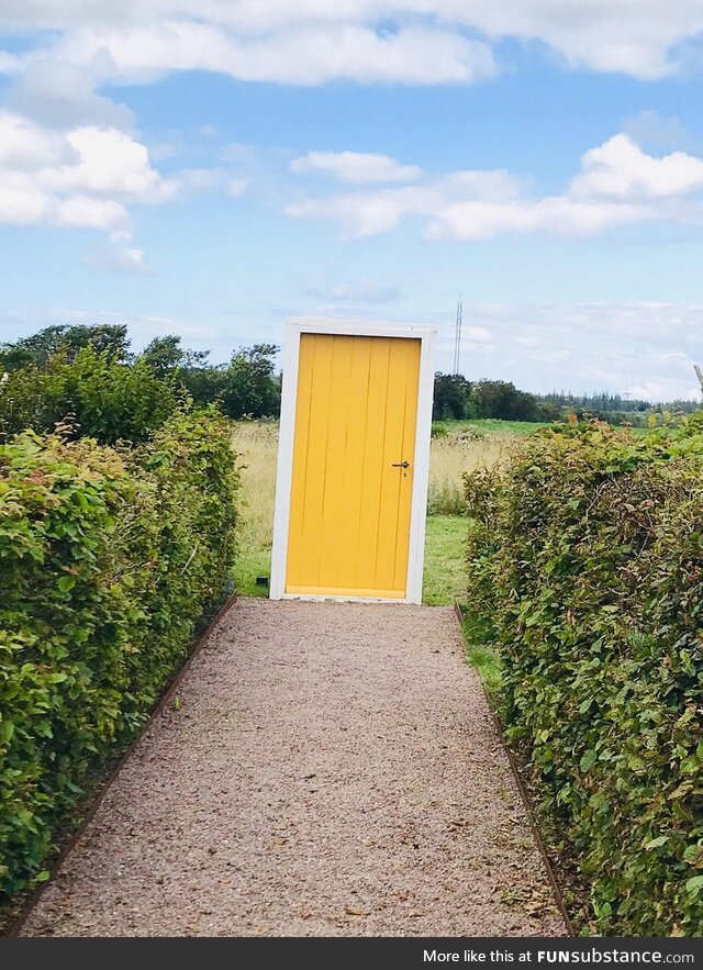 A doorway to a field