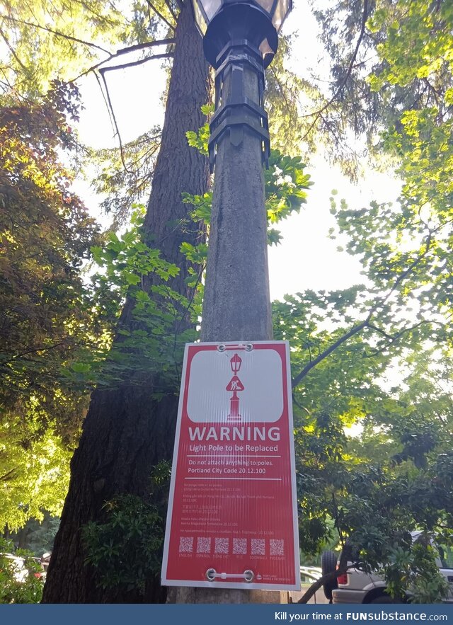 The sign on this pole says “Do Not Attach Anything To Poles.”