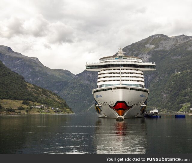 The "MS Let me Speak to your Manager" docking at Geirangerfjorden