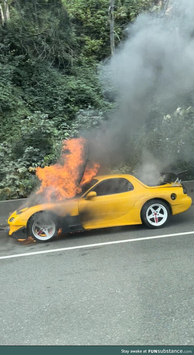 Car burning on the highway