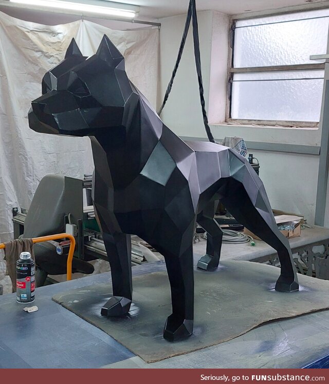 Pitbull sculpture made out of stainless steel