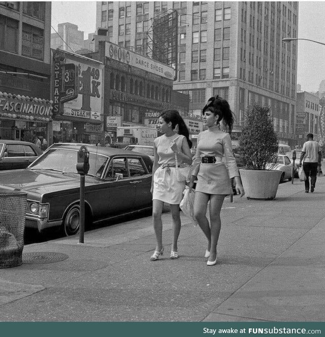 Two young women walking along Broadway between 48th and 49th Streets. New York (1969)