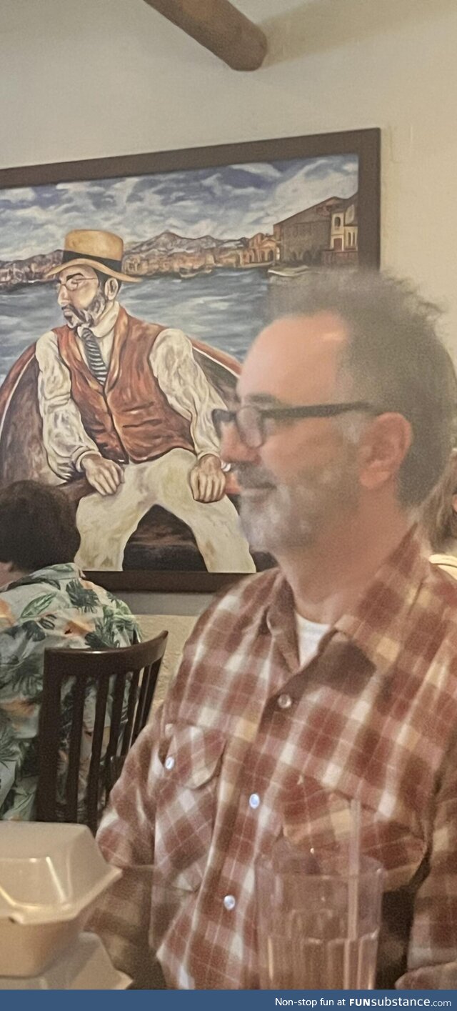 My dad looks exactly like a man in a painting in an Italian restaurant