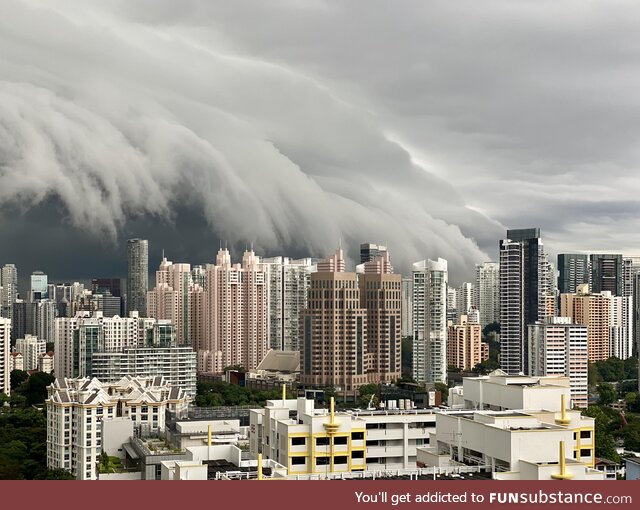 [OC] The view from the balcony of my old apartment before a storm hit Singapore, November