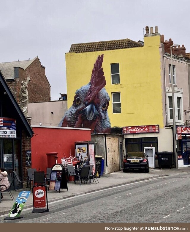 This realistic chicken art in my home town