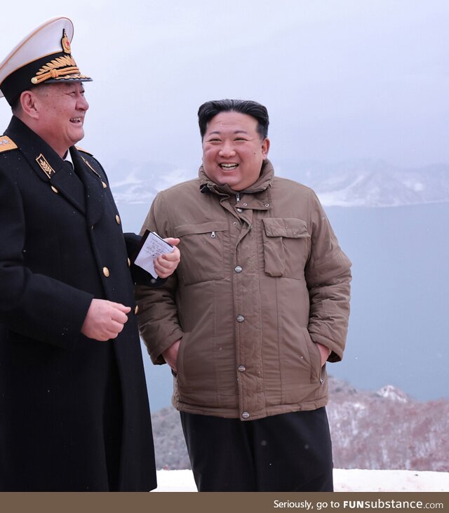 Kim Jong Un observing a nuclear missile test launch from a submarine
