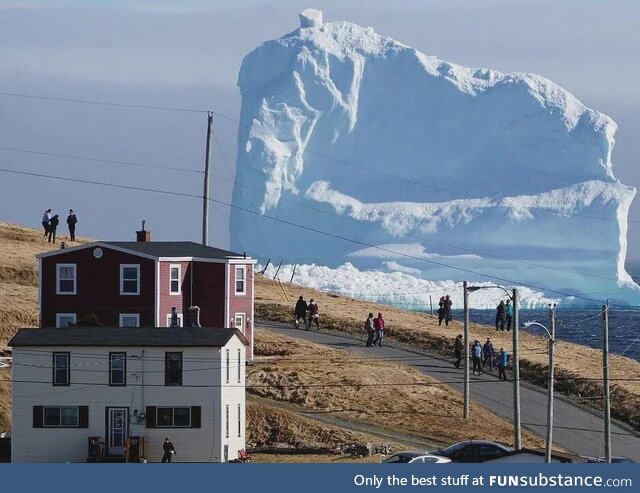 A 150-Foot Iceberg Drifts Past a Canadian Home