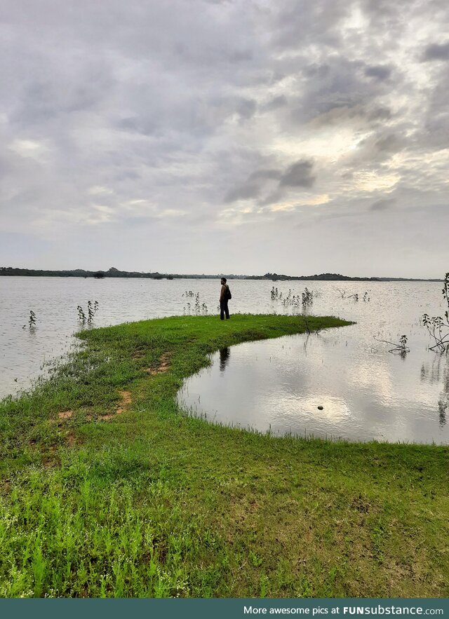 My husband at a lake early in the morning