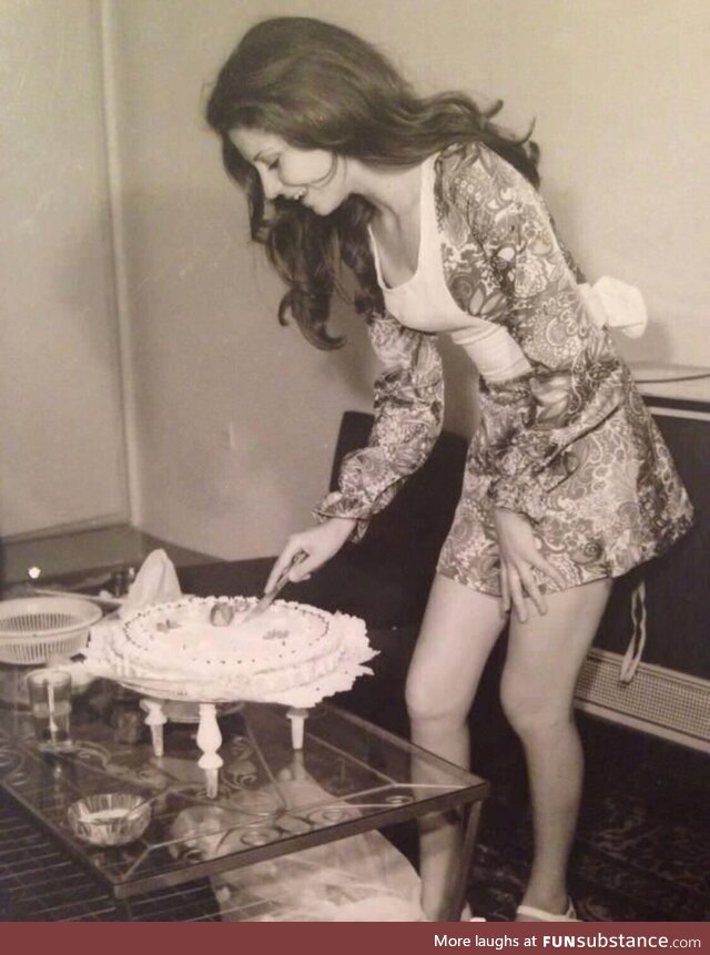Woman cutting her birthday cake in Tehran, Iran 1973
