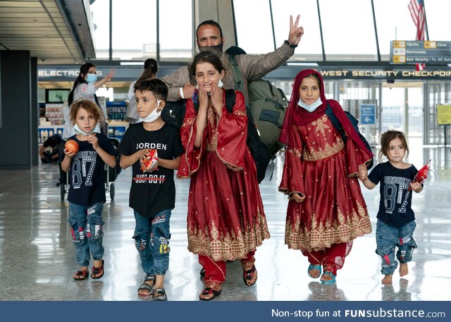 A family evacuated from Afghanistan arrives at Dulles International Airport in Chantilly,