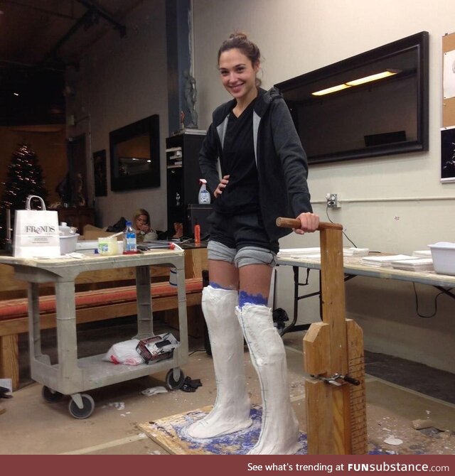 Gal Gadot standing in molds for her Wonder Woman boots