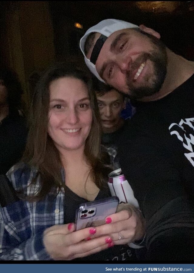 Crazy guy photobombing my girlfriend and I at a concert