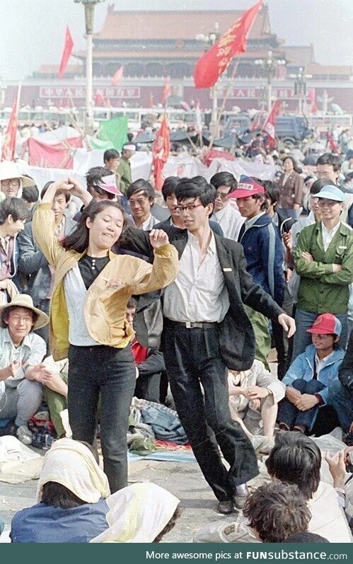 Students dance in Tiananmen Square shortly before the arrival of the Chinese military,