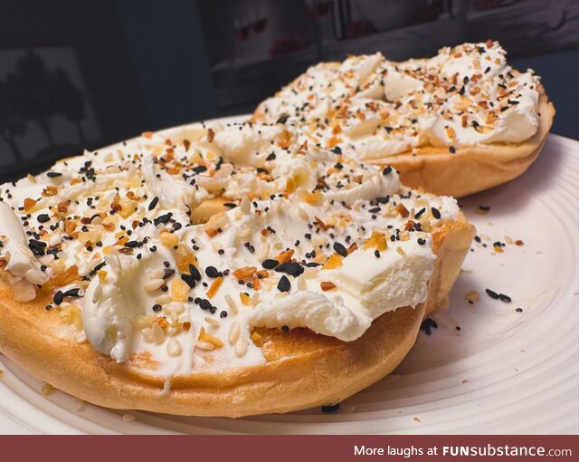 Toasted Bagel with globs of Cream Cheese, topped with Everything Bagel seasoning