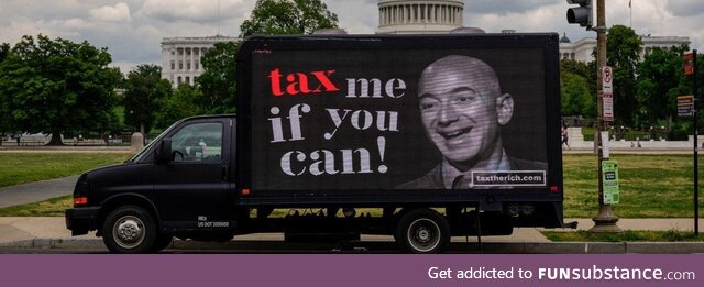 "TAX THE RICH" billboard in front of Congress