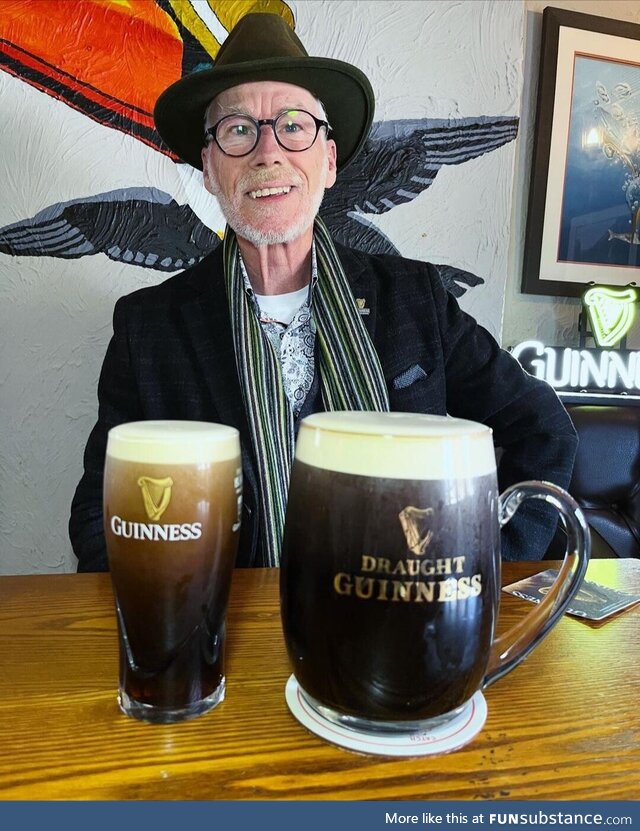 A man enjoying some Guinness