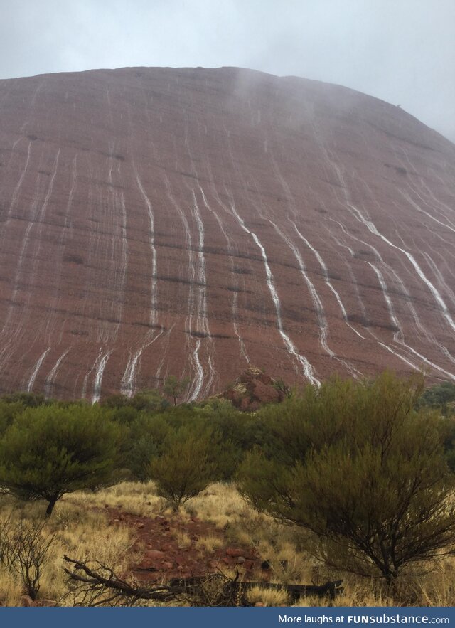 Waterfalls on Uluru, Australia, in one of the rare occurrences in which it rains