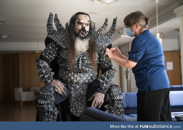 Frontman of finnish band Lordi getting second dose of COVID vaccine in full costume